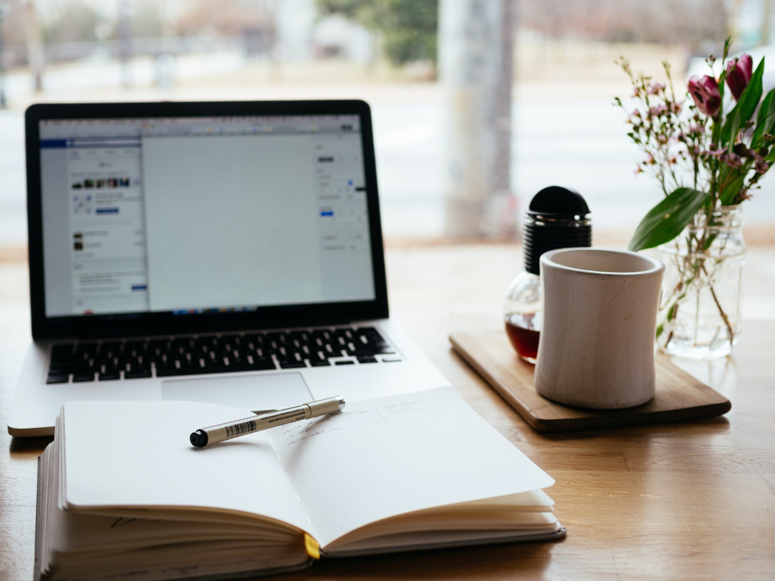 computer and journal on desk-unsplash computer and journal on desk-unsplash